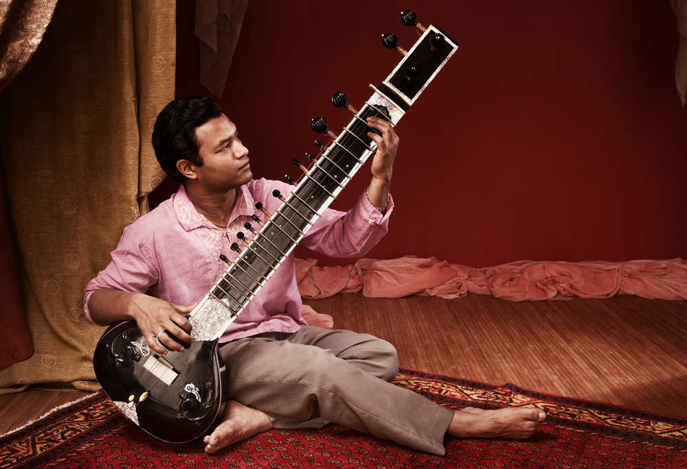 man playing sitar