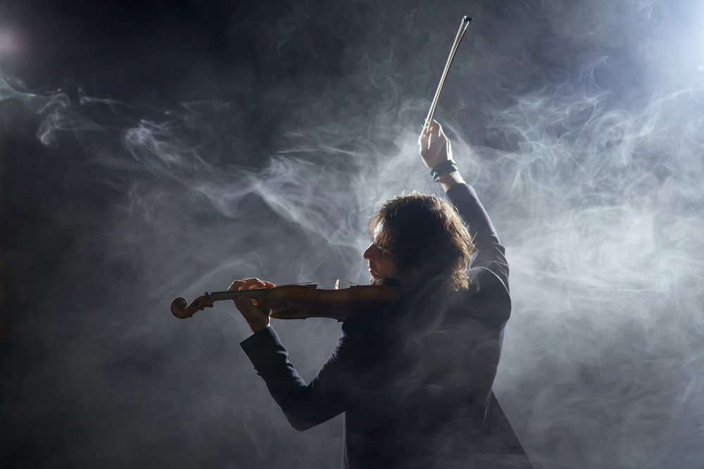 violinist in cloud of smoke