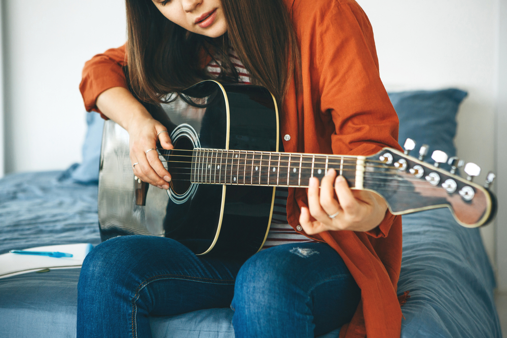 woman playing guitar