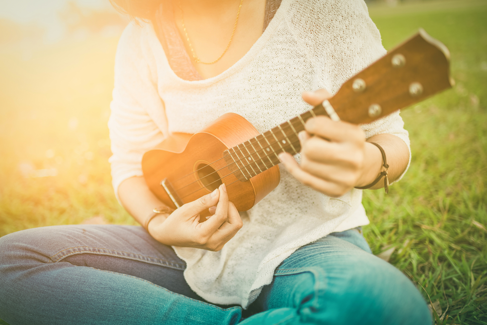 woman playing ukulele