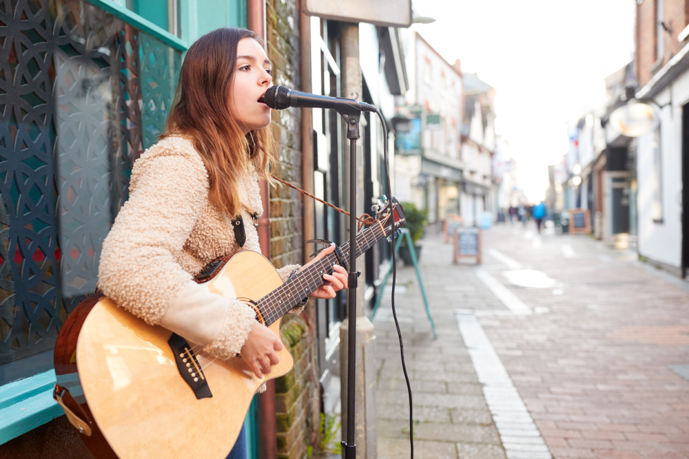 woman singing on street