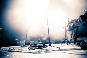 empty illuminated stage with instruments